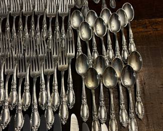 S1 - $7,500. Towle Sterling Flatware Set. 15 of each Dinner Knives, Dinner Forks, Salad Forks, Dessert Spoons. 8 of each Butter Knife, Dinner Spoon. Plus Serving Pieces. Text for Weight.
