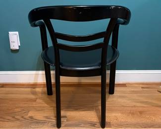 O123 - $75. Pair of Black chairs. Leather Seats. Each Measures 22.5" W x 19" D x floor to seat 17" x floor to back 28" Tall. Both show signs of wear and one seat is damaged on a corner.