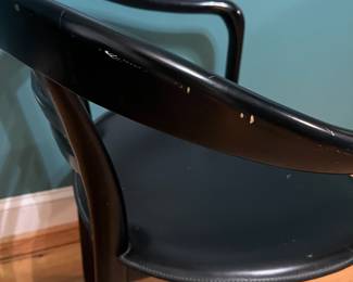O123 - $75. Pair of Black chairs. Leather Seats. Each Measures 22.5" W x 19" D x floor to seat 17" x floor to back 28" Tall. Both show signs of wear and one seat is damaged on a corner.