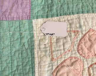 O62 - $65. Vintage Quilt. Measures 65” W x 77” L. Has some worn / thin spots.