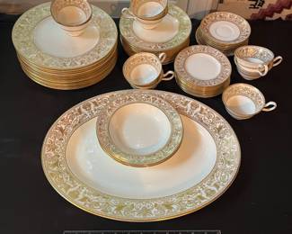 O129 - $400. Set of Wedgwood Gold "Florentine" China. 12 - 10.75" Plates, 11 - 8.25" Salad Plates, 2 - 8" Soup Bowls, 9 - 6" Bread Desert Plates, 7 - 6" Saucers, 9 - Tea Cups, 1 - 17.5" x 13.5" Oval Serving Platter.