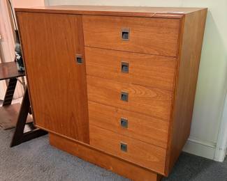 O42 - $225. Teak Veneer Chest of Drawers. Good overall condition. Measures 40” W x 18” D x 39” Tall.