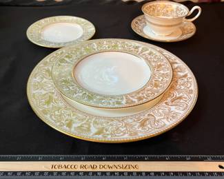 O129 - $400. Set of Wedgwood Gold "Florentine" China. 12 - 10.75" Plates, 11 - 8.25" Salad Plates, 2 - 8" Soup Bowls, 9 - 6" Bread Desert Plates, 7 - 6" Saucers, 9 - Tea Cups, 1 - 17.5" x 13.5" Oval Serving Platter.