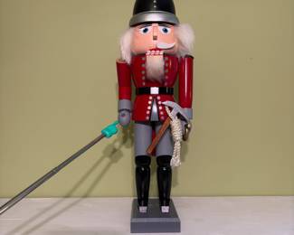 O52 - $25. Old World Christmas Fireman Nutcracker. Missing one part of mustache and long handled axe. Measures 15.5" Tall.