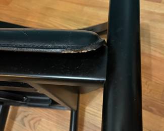 O123 - $75. Pair of Black chairs. Leather Seats. Each Measures 22.5" W x 19" D x floor to seat 17" x floor to back 28" Tall. Both show signs of wear and one seat is damaged on a corner.