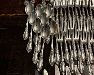 S1 - $7,500. Towle Sterling Flatware Set. 15 of each Dinner Knives, Dinner Forks, Salad Forks, Dessert Spoons. 8 of each Butter Knife, Dinner Spoon. Plus Serving Pieces. Text for Weight.