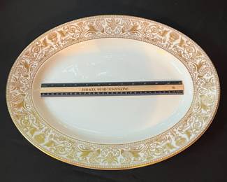 O129 - $400. Set of Wedgwood Gold "Florentine" China. 12 - 10.75" Plates, 11 - 8.25" Salad Plates, 2 - 8" Soup Bowls, 9 - 6" Bread Desert Plates, 7 - 6" Saucers, 9 - Tea Cups, 1 - 17.5" x 13.5" Oval Serving Platter.