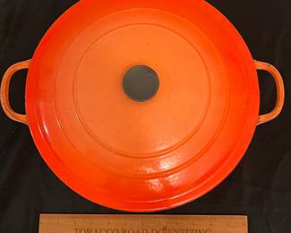 O86 - $40. Le Creuset Flame Orange “G” 7.25 Qt Dutch Oven.