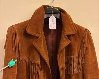 O72 - $100. 1980’s Woman’s Neiman Marcus Sued Fringe Jacket. No size. Measures 18” pit-pit, 26” shoulder-bottom hem.