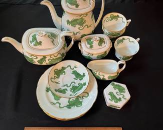 O110 - $400. Set of Wedgwood "Chinese Tigers" Green China. 1 - Coffee Pot, 1 Tea Pot (has a crack), 1 - Saucer, 1 - Trinket Dish, 1 - Cream and Sugar, 3 - Tea Cups, 3 - 8.25" Plates