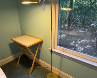 O22 - $25. Brass Floor Lamp. Measures 50" Tall. The pole leans.