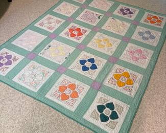 O62 - $65. Vintage Quilt. Measures 65” W x 77” L. Has some worn / thin spots.