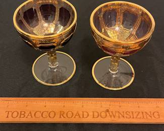 O6 - $1250. Antique Bohemian or Moser-style cut-to-clear glass decanter and cordial set with ornate gold gilding. 2 Tall Wine Glasses. 5 Champagne Coupe. Decanter & Stopper. One glass has a *tiny* chip in the base. All other pieces are in excellent condition!