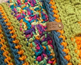 O59 - $35. Handmade Crochet Blanket. Measures 41“ W x 52” L.