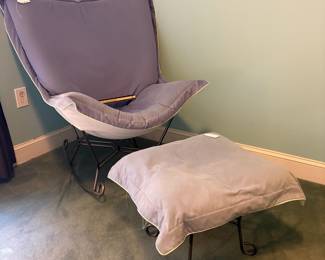 O23 - $125. Howard Elliott Lavender Scroll Puff Butterfly Rocker and Ottoman. Measures 36” W x 32” D x 42” Tall.