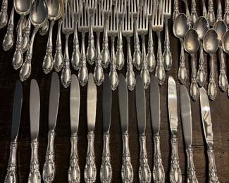 S1 - $7,500. Towle Sterling Flatware Set. 15 of each Dinner Knives, Dinner Forks, Salad Forks, Dessert Spoons. 8 of each Butter Knife, Dinner Spoon. Plus Serving Pieces. Text for Weight.