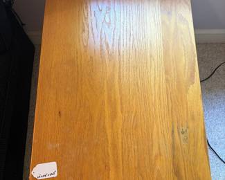 O12 - $25. Solid Wood Side Table. Measures 20” W x 26” D x 22.5” Tall.