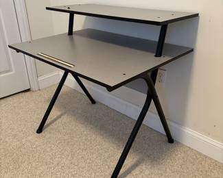 O24 - $30. Computer Desk with Monitor Stand. Measures 35.75” W x 26.5” D x 34.25” Tall.
