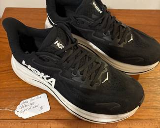 O82 - $30. Hoka One One Clifton. Woman’s Size 10. Shows light wear.