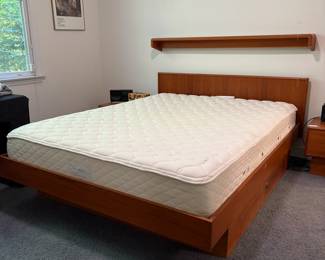 O39 - $250. Queen Platform Bed Frame - Made in Canada. Teak Veneer. Has 2 drawers underneath. This includes Platform Bed Frame, Headboard & Floating Shelf. Measures 64” W x 82.5“ L x 31” Tall.
