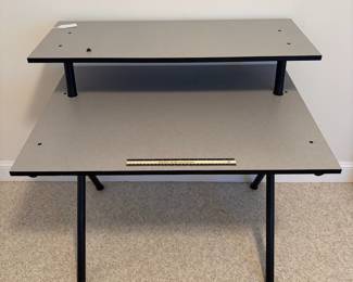 O24 - $30. Computer Desk with Monitor Stand. Measures 35.75” W x 26.5” D x 34.25” Tall.