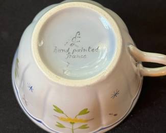 O109 - $275. Set of Longchamp "Printemps" Pottery. 9 - 10" Dinner Plates, 9 - 7.5" Salad Plates, 11 - 6.75" Desert Plates, 11 - 6.25" Saucers, 7 - Tea Cups, 1 Gravy Boat, 1 Sugar Dish.