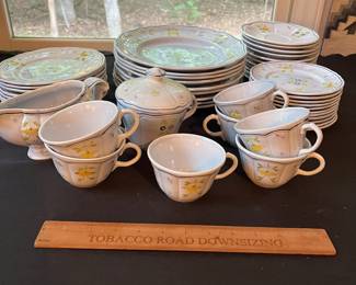 O109 - $275. Set of Longchamp "Printemps" Pottery. 9 - 10" Dinner Plates, 9 - 7.5" Salad Plates, 11 - 6.75" Desert Plates, 11 - 6.25" Saucers, 7 - Tea Cups, 1 Gravy Boat, 1 Sugar Dish.