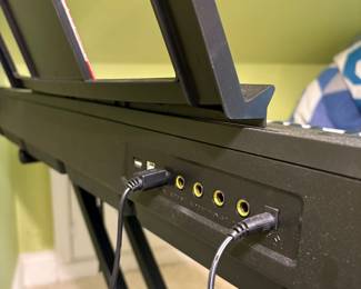 O26 - $40. BCP Digital Piano. Measures 51” W x 14” D x 32” Tall.