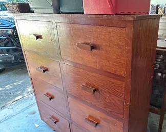 Tall wooden chest of drawers