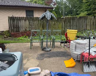 Outdoor palm tree, light patio furniture, chairs