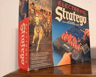 Electronic Stratego Board Game – Vintage Electronic Stratego two-player strategy board game by Milton Bradley. A classic electronic edition of the beloved military strategy game, complete in its original box (contents and completeness not verified). Great for board game collectors, retro gaming enthusiasts, or nostalgic family game nights.