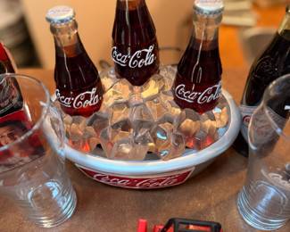 Coca-Cola Ice Bucket Centerpiece – Decorative Coca-Cola ice bucket centerpiece featuring faux ice and collectible miniature Coca-Cola bottles. A fun display piece for Coca-Cola collectors, home bars, diners, or retro Americana décor. Sold as pictured unless noted.