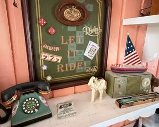 Vintage Casino-Themed Wall Décor & Collectibles – Fun collection featuring a large casino/roulette-themed shadow box wall decoration alongside a vintage rotary telephone, retro radio, patriotic sailboat décor, elephant figurine, and assorted collectibles. Great for game room, man cave, or vintage décor enthusiasts. Sold individually unless noted.