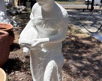 Concrete Garden Lady Statue – Elegant cast concrete garden statue depicting a graceful young woman carrying a basket. A timeless accent for gardens, patios, walkways, or landscape beds, offering classic charm and enduring outdoor appeal. Sold as found.