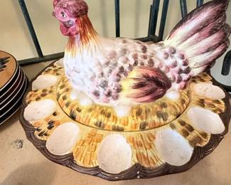 **Ceramic Hen Covered Serving Dish** – Decorative ceramic hen serving dish with matching lid and textured nest base. A charming farmhouse kitchen accent that's perfect for displaying on a countertop or table, or for serving at gatherings. Great for rooster and country décor collectors.