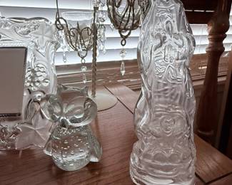 Religious Glass Figurines & Crystal Accents – Collection of decorative clear and frosted glass pieces including a Blessed Virgin Mary figurine, angel figurine, floral vase, crystal-style candle holders with hanging prisms, and other elegant glass accents. A beautiful assortment for religious displays, holiday décor, or glassware collectors. Sold individually unless noted.
