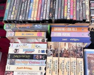 Assorted DVDs, VHS Tapes & Music CDs – Large collection of entertainment media including feature films, TV series, children's titles, Spanish-language movies, music concert DVDs, CDs, VHS tapes, and instructional videos. Great selection for collectors, movie lovers, or anyone looking to expand their media library. Sold individually unless noted.