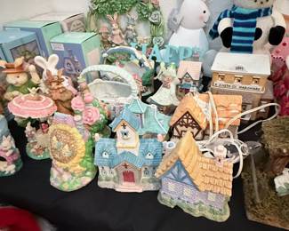 Easter & Spring Collectibles Collection – Charming assortment of Easter and spring-themed décor including ceramic bunny figurines, lighted cottages, floral baskets, decorative eggs, seasonal signs, snowman décor, and collectible keepsake houses. A delightful collection for holiday decorating or seasonal display. Sold individually unless noted.
