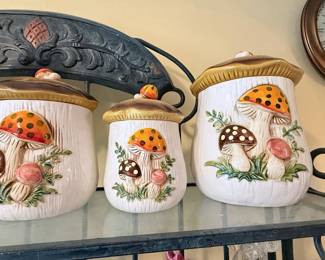 **Vintage Ceramic Mushroom Canister Set (3-Piece)** – Charming three-piece ceramic kitchen canister set featuring raised mushroom designs with fitted lids. A whimsical vintage-style addition to farmhouse, cottagecore, or retro kitchen décor. Includes large, medium, and small canisters. A staple for the cottage-core girlies.
