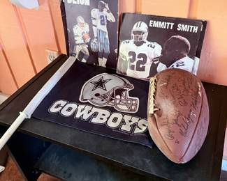 Dallas Cowboys Memorabilia Collection – Assorted Dallas Cowboys collectibles featuring Deion Sanders and Emmitt Smith display plaques, a Cowboys logo pennant, and a football covered with player autographs (authenticity not verified). A great collection for Cowboys fans, sports memorabilia enthusiasts, or game room displays. Sold individually unless noted.