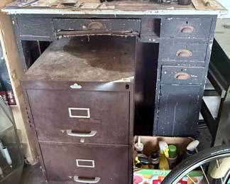 Vintage Industrial Workbench with Filing Cabinet – Heavy-duty vintage workbench featuring a distressed painted finish, multiple drawers, and a spacious work surface. Paired with a matching vintage metal two-drawer filing cabinet, this setup is perfect for a workshop, garage, studio, or industrial-inspired space. Great restoration potential. Contents not included unless noted.