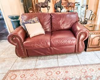 Red Leather Love Seat in good condition