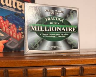 **Strike It Rich on TV: Practice to Be a Millionaire** – Vintage trivia board game inspired by classic television game shows. Features **1,000 questions- designed for one or more players to test their knowledge and game show skills. Great for family game nights, trivia enthusiasts, or retro game collectors. Original box included; contents and completeness not verified.