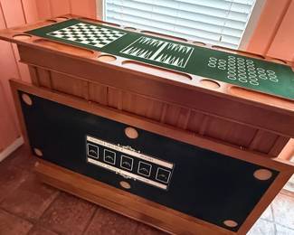 Multi-Game Pub Table – Solid wood pub-style game table featuring built-in surfaces for chess, checkers, backgammon, and card games, along with integrated drink holders around the perimeter. A fun and versatile addition to a game room, man cave, or entertainment space. Perfect for family game nights and casual gatherings. Sold as found.