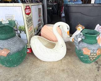 Outdoor Garden Décor Collection – Assorted outdoor decorative planters and garden statues including textured grapevine-style planters, swan planters, duck figurines, and other whimsical yard accents. A charming collection for gardens, patios, porches, or landscape displays. Sold individually unless noted.