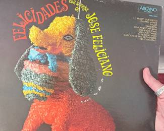 José Feliciano "Felicidades con el Ídolo" Vinyl Record – Vintage LP by José Feliciano featuring the festive album *Felicidades con el Ídolo*. A wonderful addition for Latin music fans, vinyl collectors, or anyone who enjoys classic Spanish-language recordings. Sold as found; condition not verified.