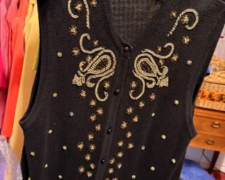 Vintage Donnkenny Embellished Sweater Vest – Elegant black Donnkenny sweater vest featuring intricate gold beading, rhinestone accents, and ornate embroidered scrollwork. A beautiful vintage fashion piece perfect for holiday wear, evening occasions, or collectors of embellished knitwear. Sold as found.