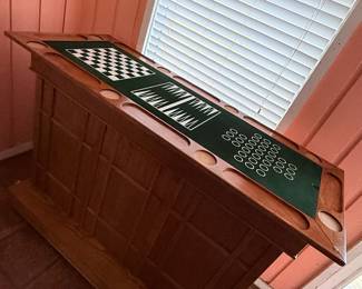 Multi-Game Pub Table – Solid wood pub-style game table featuring built-in surfaces for chess, checkers, backgammon, and card games, along with integrated drink holders around the perimeter. A fun and versatile addition to a game room, man cave, or entertainment space. Perfect for family game nights and casual gatherings. Sold as found.
