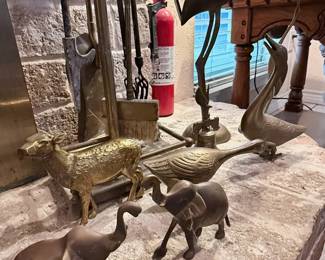 Decorative Brass Animal Figurine Collection – Assorted metal animal figurines including cranes, ducks, elephants, and a sheep, crafted in brass and brass-tone finishes. A charming collection for wildlife lovers, traditional décor, or curio cabinet displays. Fireplace tools sold separately unless noted.