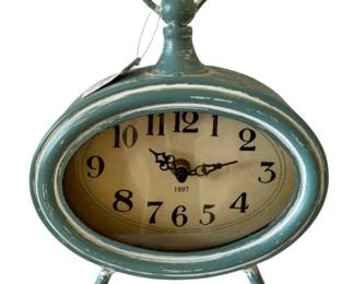 42 - Tabletop Teal Clock - 11 x 7.5 x 2.25 (Description): Battery Operated - Used as is electric/electronic/mechanical item. No guarantee all components, untested.